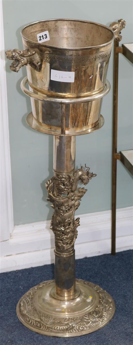 A Chinese silvered metal wine cooler and stand 71cm high